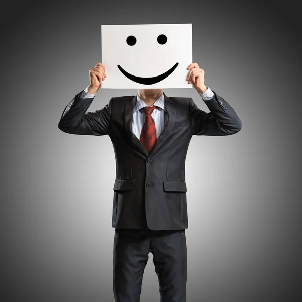 Business man holding a poster — Stock Photo, Image