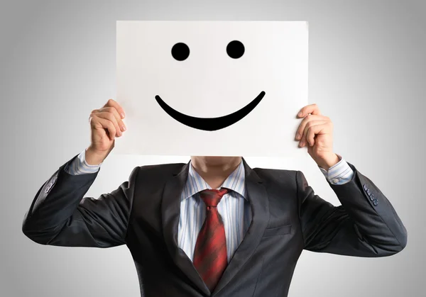 Business man holding a poster — Stock Photo, Image