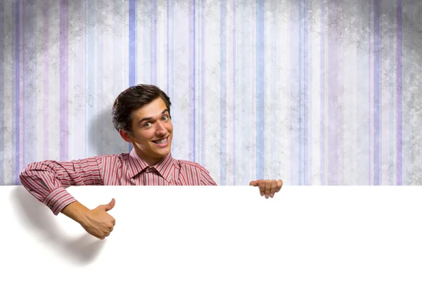 Homem segurando uma bandeira — Fotografia de Stock