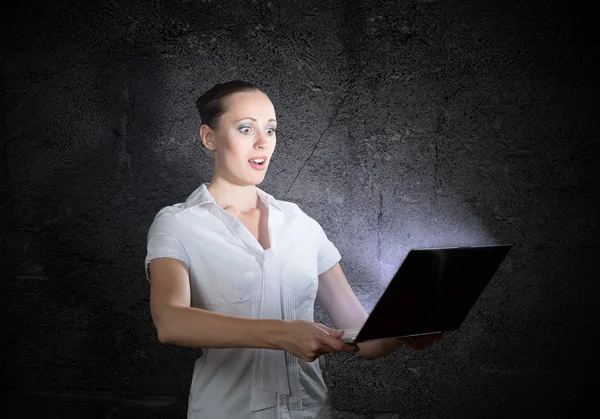 Woman holding a laptop — Stock Photo, Image