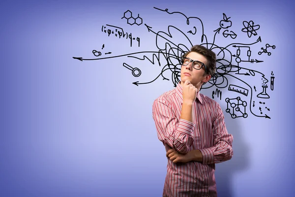 Joven científico con gafas pensando — Foto de Stock