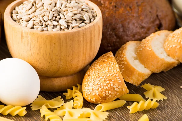 Fresh bread, eggs, pasta and grains — Stock Photo, Image