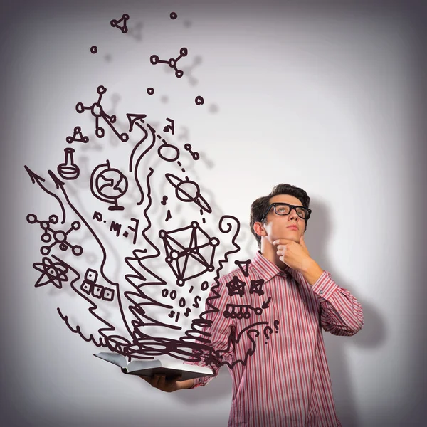 Young scientist holding a book — Stock Photo, Image