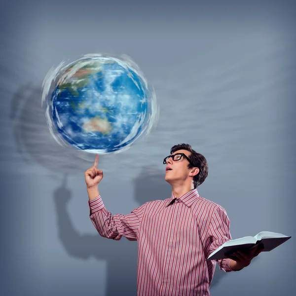 Young man with a book thinks — Stock Photo, Image