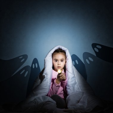 girl under the covers with a flashlight clipart