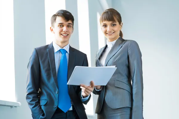 Two business partners discussing reports — Stock Photo, Image