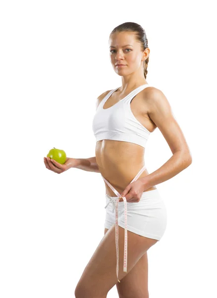 Young athletic woman measuring waist — Stock Photo, Image