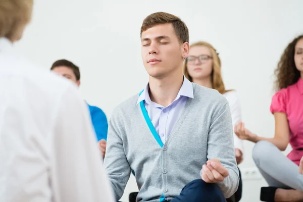 Group of young people meditating — Stock Photo, Image