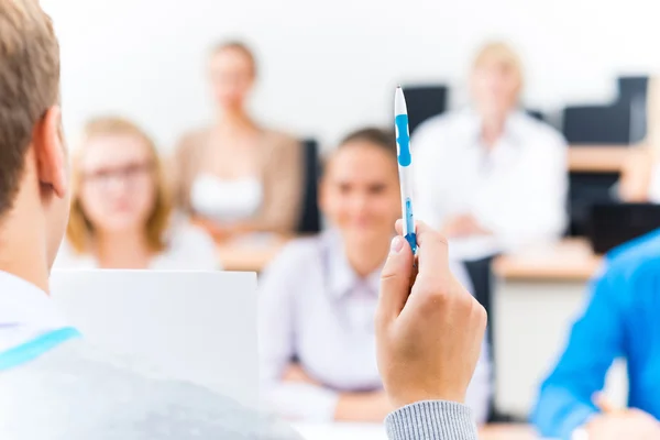 Close-up of hands of a teacher with a pen — Stock Photo, Image