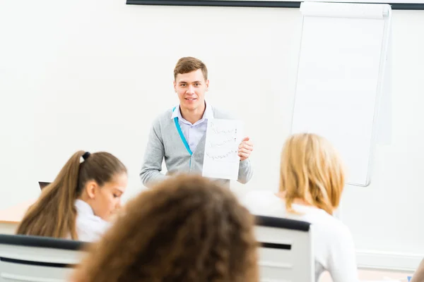 Teacher talking with students — Stock Photo, Image