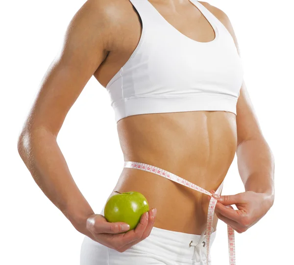 Young athletic woman measuring waist — Stock Photo, Image