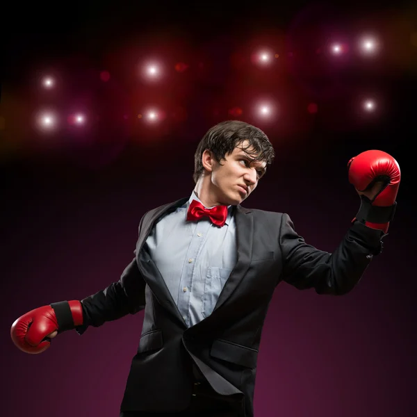 Businessman with boxing gloves in the ring — Stock Photo, Image