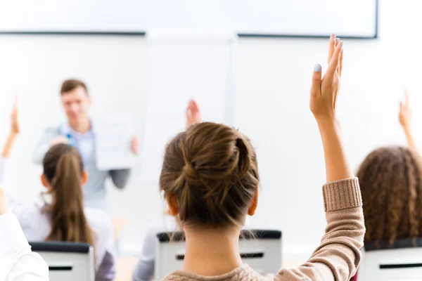 Female hand raised in class — Stock Photo, Image