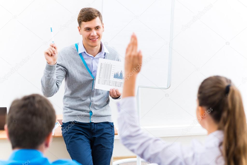 teacher talking with students