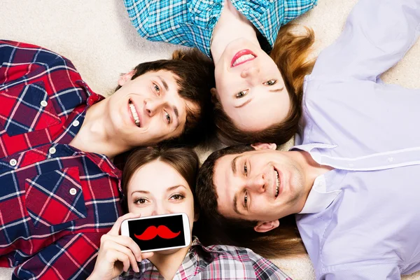 Woman pressed her lips to the phone — Stock Photo, Image