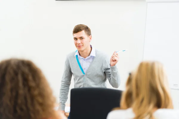 Teacher talking with students — Stock Photo, Image