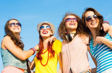 group of young people wearing sunglasses and hat