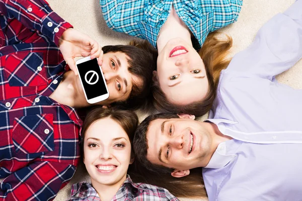 Four young men lie together — Stock Photo, Image