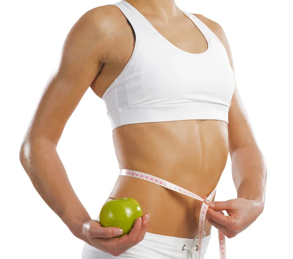 Young athletic woman measuring waist — Stock Photo, Image