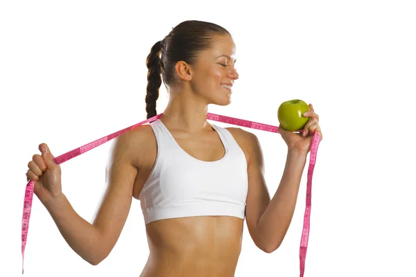 Young attractive woman with measuring tape — Stock Photo, Image