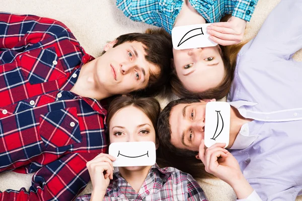 Four young men lie together — Stock Photo, Image