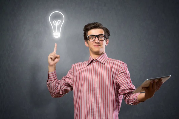 Young man holding a tablet — Stock Photo, Image