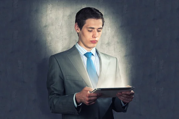 Businessman with a tablet computer — Stock Photo, Image