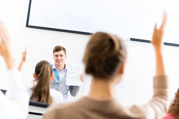 Teacher talking with students — Stock Photo, Image