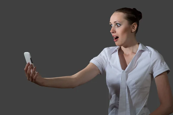 Business woman holding a cell phone — Stock Photo, Image