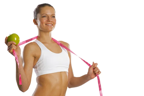 Young attractive woman with measuring tape — Stock Photo, Image