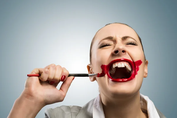 Young woman with vivid red mouth — Stock Photo, Image