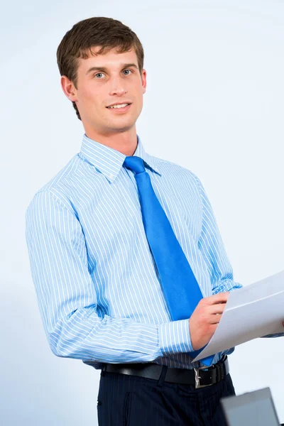 Businessman in the office with business papers Stock Image