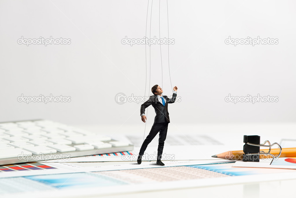 businessman puppet doll is on the desk