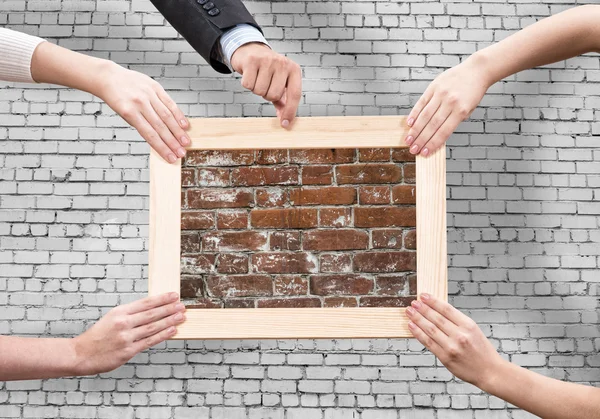 Hands holding frames — Stock Photo, Image