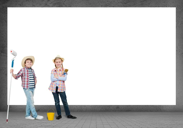 Children with paint rollers — Stock Photo, Image