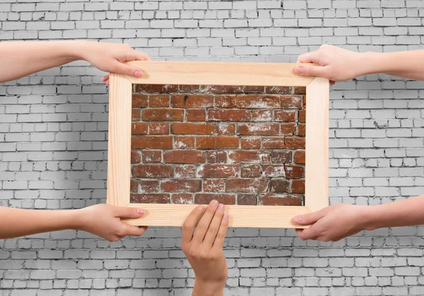 Hands holding frames — Stock Photo, Image