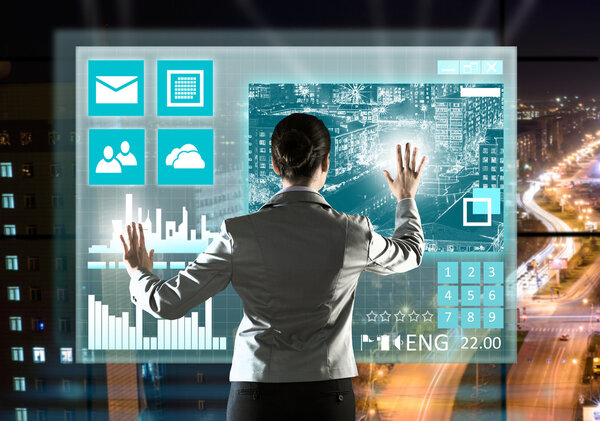 Businesswoman touching icon of media screen
