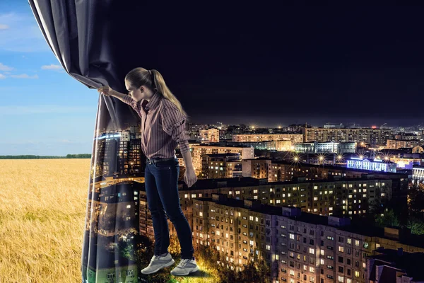 Young woman pushes curtain — Stock Photo, Image