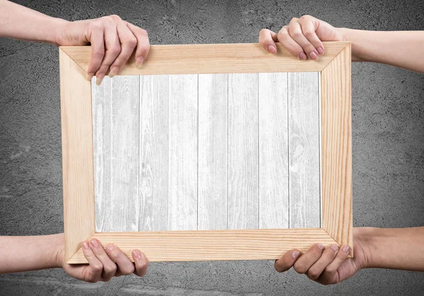 Hands holding frame — Stock Photo, Image