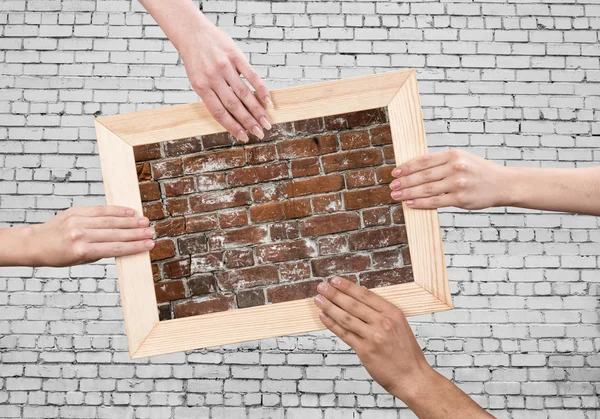 Hands holding frames — Stock Photo, Image