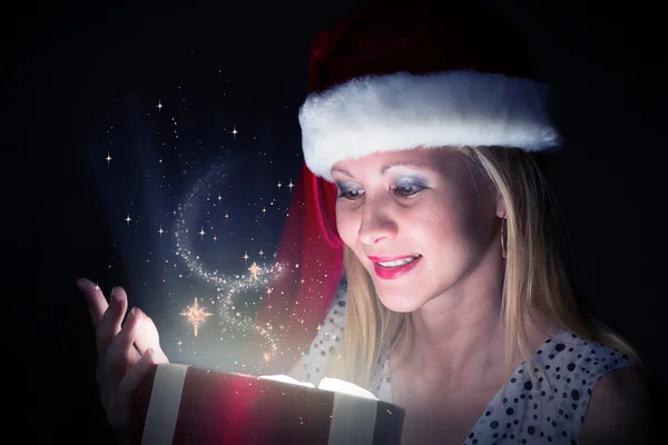 Woman opens a box of magic — Stock Photo, Image