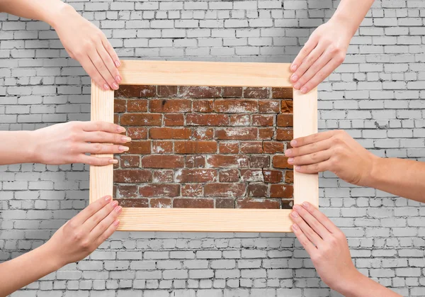 Hands holding frames — Stock Photo, Image