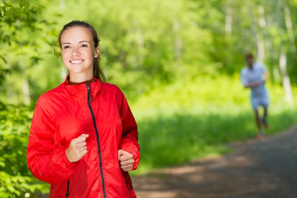 Young female athlete running — Stock Photo, Image