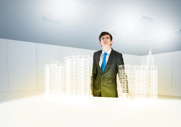 Businessman and digital model of construction — Stock Photo, Image