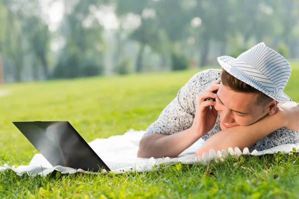 Young man with a cell phone — Stock Photo, Image