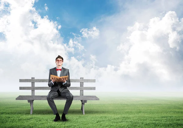 Young student with a book — Stock Photo, Image