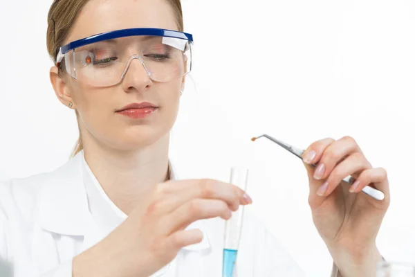 Young female research scientist puts sample — Stock Photo, Image