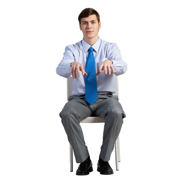 Hombre de negocios se sienta en una silla — Foto de Stock