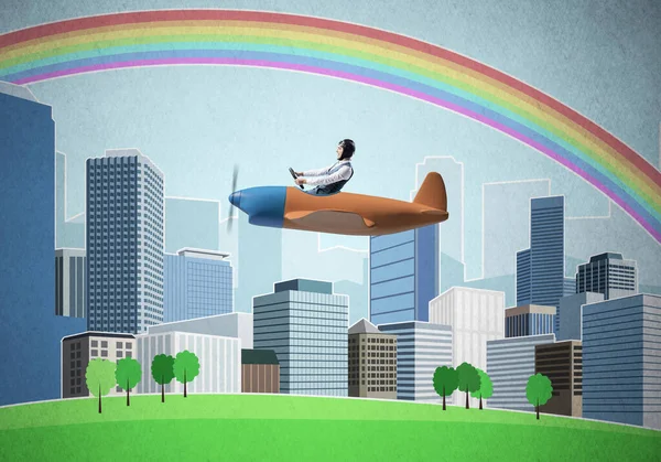 Empresário voando em pequeno avião de hélice — Fotografia de Stock