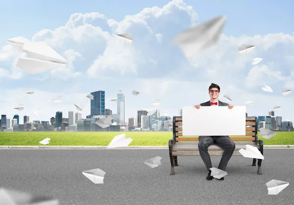 Businessman with an empty banner — Stock Photo, Image